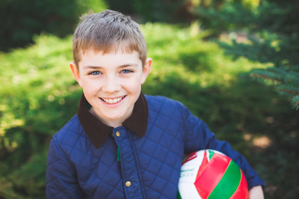 2_boy smiling with volleyball_opt (2)