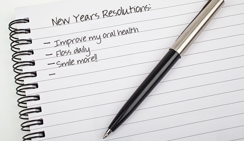 New Years Resolutions written on a note pad.