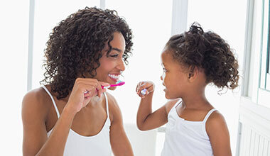Mom and Child brushing teeth