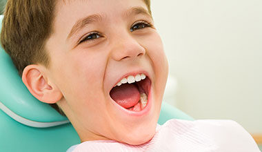 boy smiling at dental visit